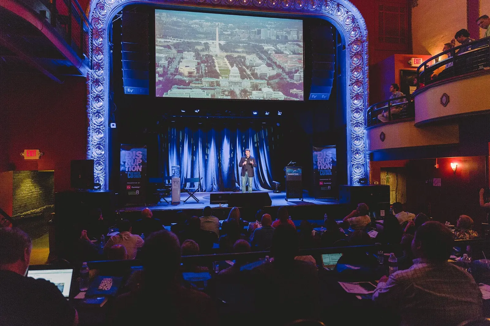 Kirk Drake on stage in front of a large audience